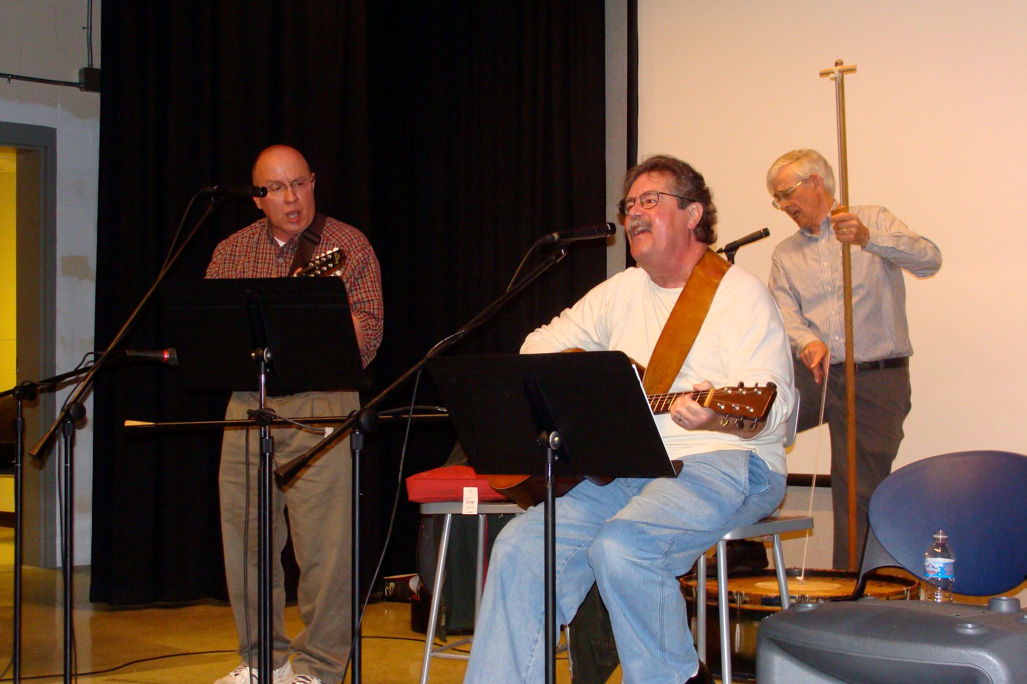 Mike Foster, seated, Rick Becker, left, and Brooks McDaniel perform at ICC North in Peoria in 2009.